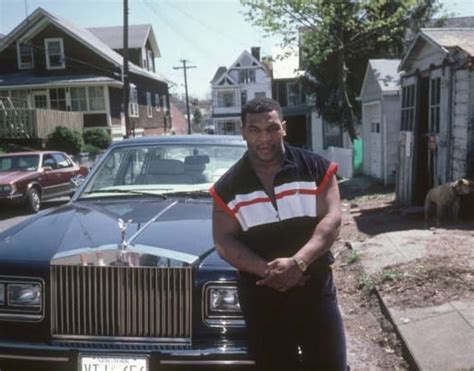 Mike Tyson poses infront of his Rolls Royce on a side street in New York (1987) - @MikeTyson # ...