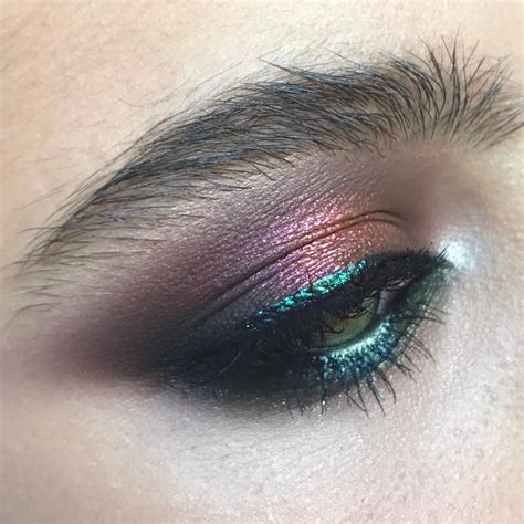 Metallic teal, magenta, plum, and silver eye shadow. Mermaid color scheme makeup. Stunning ...