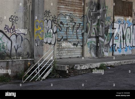 a beautifully decayed urban street alleyway with graffiti Stock Photo - Alamy