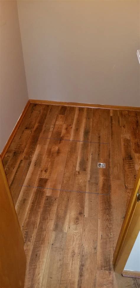 Vinyl plank flooring over a crawlspace access door. Nothing fancy but installed properly : r ...