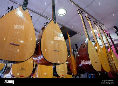 Istanbul, Turkey 2022. Rows of Turkish ethnic string instruments saz and baglama at a store on ...