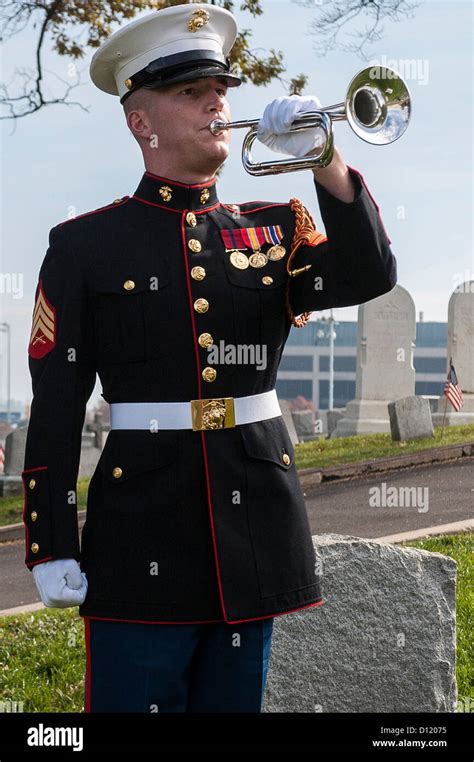 A US Marine Drum & Bugle Corps bugler plays taps during a Stock Photo, Royalty Free Image ...