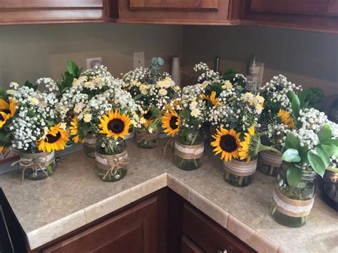 Our rustic sunflower centerpieces #sunflowerwedding | Rustic sunflower centerpieces, Sunflower ...