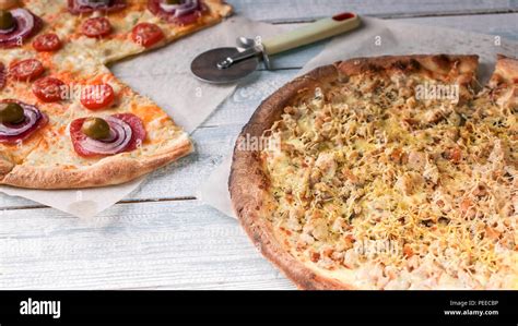 Italian pizza with salami and meat. Wooden rustic background Stock Photo - Alamy