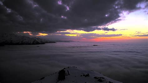 8K After sunset over the clouds in the mountains 7672215 Stock Video at ...