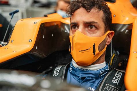 Ricciardo sits in the McLaren MCL35M cockpit for the first time