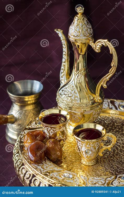 Traditional Golden Arabic Coffee Set with Dallah, Coffee Pot and Dates. Dark Background Stock ...