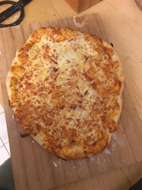 Homemade cheese pizza! Trying to get better at making it round : r/Pizza