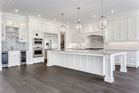 White kitchen inspiration, oversized island, white cabinets, wood floors, glam, elegant, ne ...