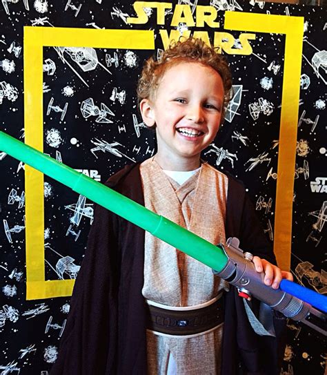 Star Wars photo backdrop for party with fabric from store, yellow duck tape and cut out letters ...