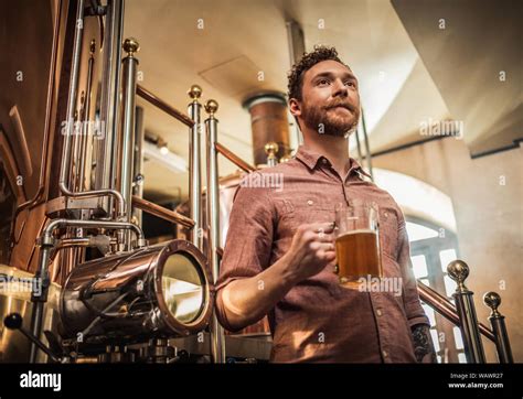 Man tasting fresh beer in a brewery Stock Photo - Alamy