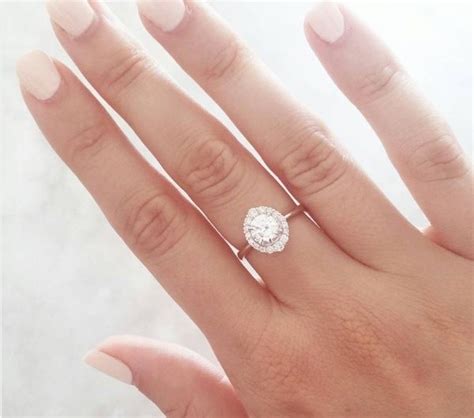 Why does a woman wear her engagement ring on her right hand? - Quora