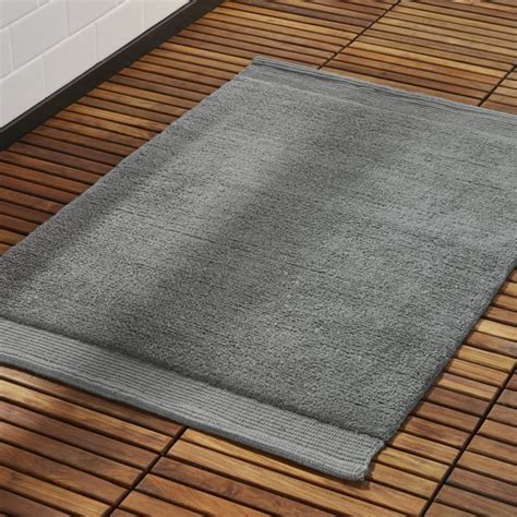 Shop Surface Dark Grey Bath Mat. Lush mat lays it on thick. Crafted using an innovative spinning ...