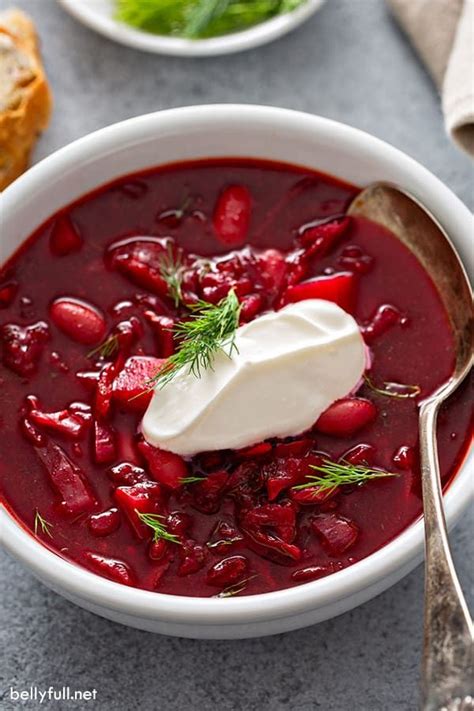 Borscht (beet soup) is sweet and sour, made with red beets and other vegetables, then topped ...