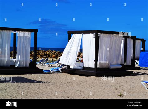 Cabanas on the beach during mid day Stock Photo - Alamy