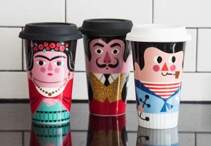 three travel mugs with painted characters on them are sitting on a counter in front of a tiled wall