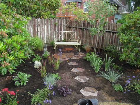 a garden with rocks and flowers in it