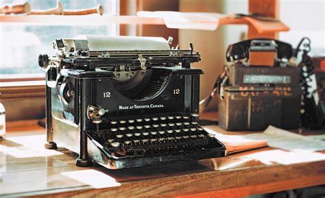 Classic Black Typewriter on Brown Wooden Desk · Free Stock Photo