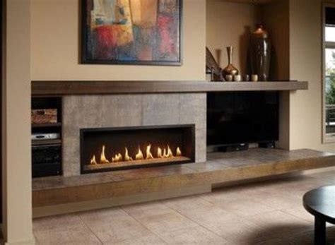 Long mantle along wall | Contemporary fireplace, Fireplace design, Modern fireplace