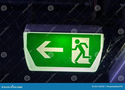 Green Exit Sign With Running Person And Green Arrow Shows Guidance ...