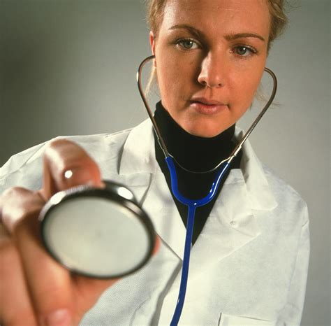 Patient's Eye View Of A Gp Doctor With Stethoscope Photograph by Tek Image