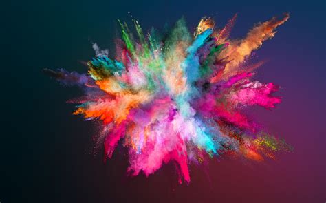 Colored powder explosion on gradient background. - Incus