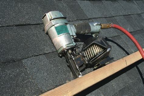 Pneumatic roofing nail gun stock image. Image of roofing - 4313301