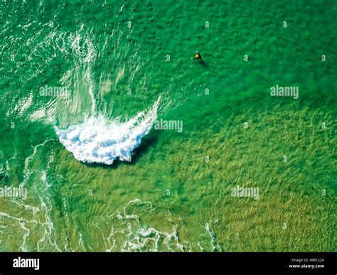 Surfers Waiting Waves on the Surface of the Ocean, aerial view Stock ...