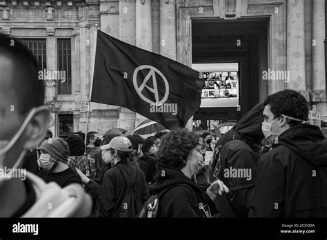 Anarchy flag fluttering during the protest assembly in solidarity to Black Lives Matter movement ...