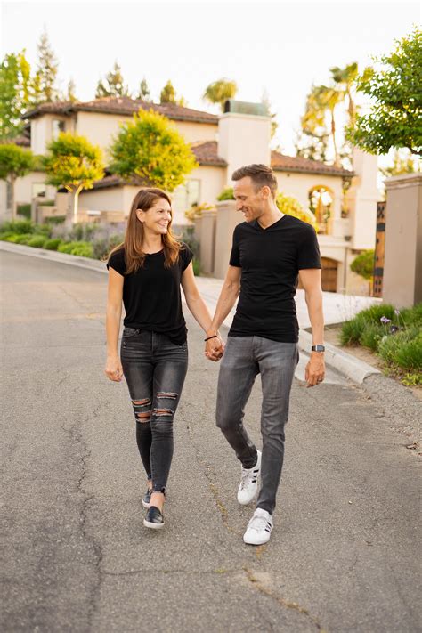 Man and Woman Holding Hands While Walking on the Street · Free Stock Photo