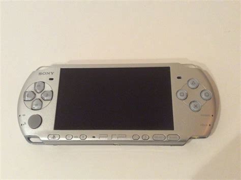 Sony PSP-3000 Portable Mystic Silver With 2 Games - iCommerce on Web