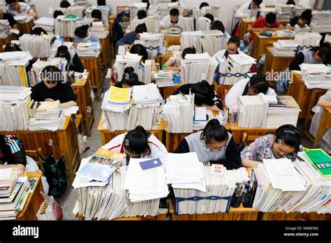 Chinese students review textbooks in preparation for the upcoming National College Entrance Exam ...