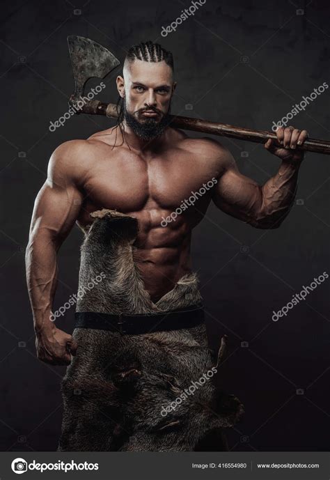 Viking with huge biceps and naked torso posing with axe Stock Photo by ...