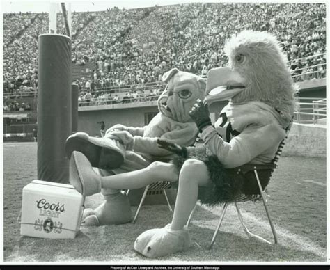 Southern Miss mascot "Seymour" and Mississippi State mascot "Bully" relax behind the goalpost ...