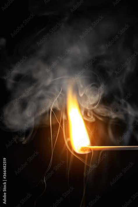 match flame dark background Stock Photo | Adobe Stock