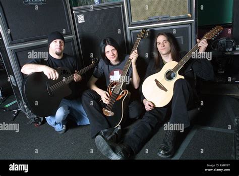 Soil band members are shown posing with their acoustic guitars and amplifiers Stock Photo - Alamy