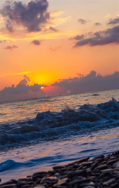 Amazing Sea Sunset on the Pebble Beach, the Sun, Waves, Clouds Stock ...