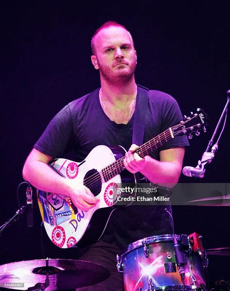 Coldplay drummer Will Champion plays guitar at the iHeartRadio Music ...