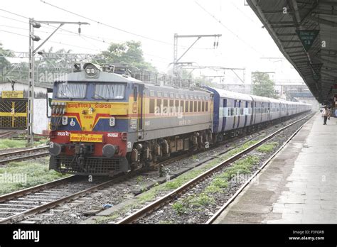 Electric Locomotive engine passenger Kushinagar express train leaving Thane railway station ...