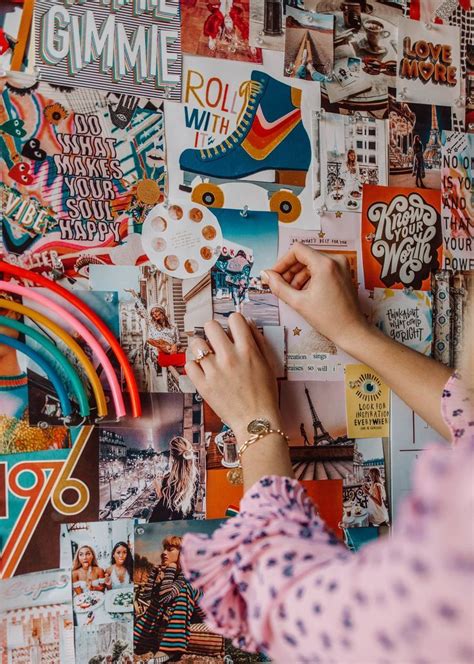 a woman is working on a wall covered with posters and magnets that are all over the place