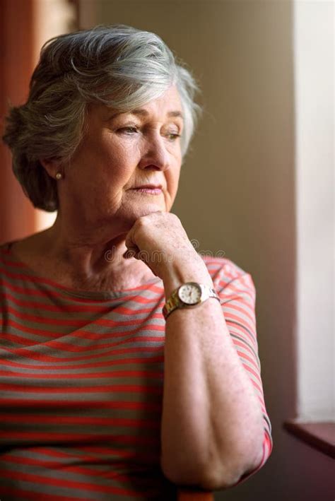 Senior Woman, Worried and Thinking at Window for Memory, Ideas or Home ...