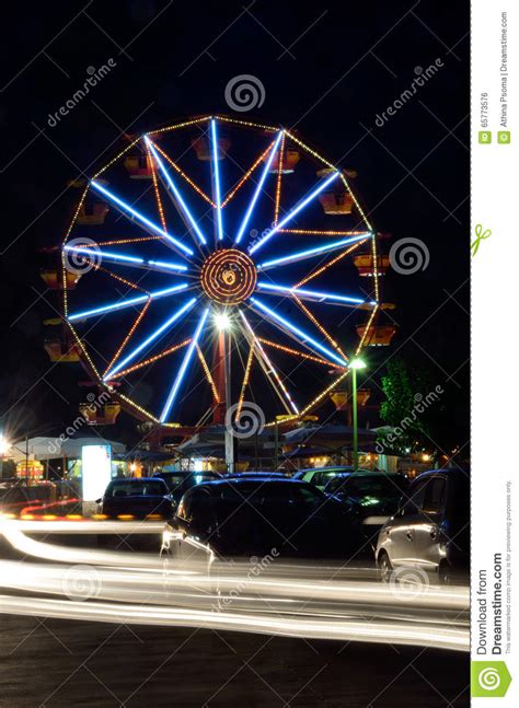 Ferris wheels at night stock photo. Image of colour, entertainment - 65773576