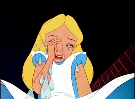 an animated image of a blonde girl crying in bed with her hand on her face