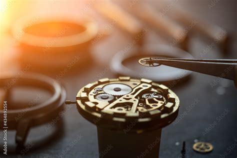 Mechanical watch repair process. Open pocket wristwatch. vel Stock Photo | Adobe Stock