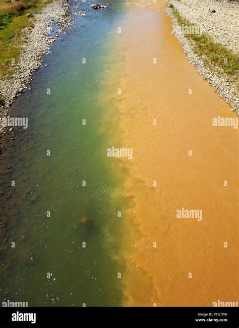 polluted river, half dirty, half clean Stock Photo - Alamy