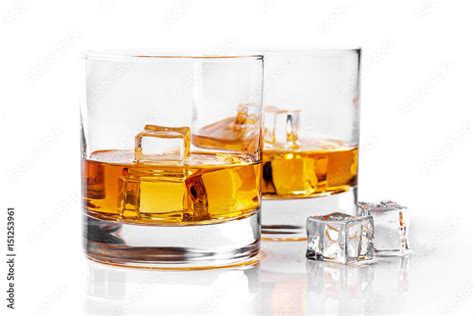 whiskey glasses with ice cubes isolated on white background Stock Photo ...