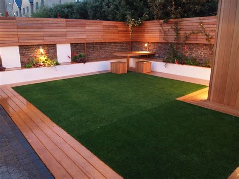 Artificial grass and decking look great with good garden lighting http ...