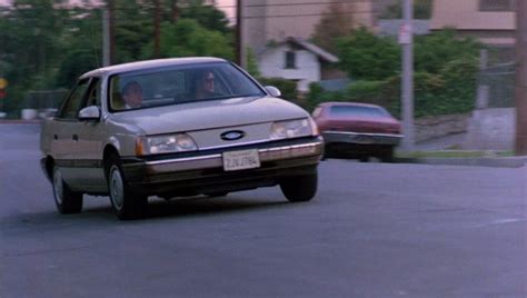 IMCDb.org: 1986 Ford Taurus L [DN5] in "Hard to Kill, 1990"