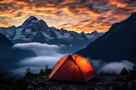 Premium AI Image | Tent in the mountains at sunset Wild camping in the ...