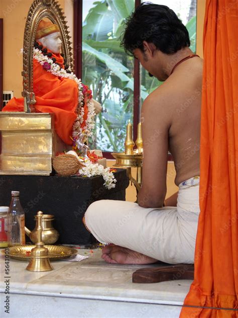 hindu priest conducting a puja in an indian temple Stock Photo | Adobe Stock